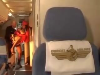 Horny stewardess rides a dick inside both holes